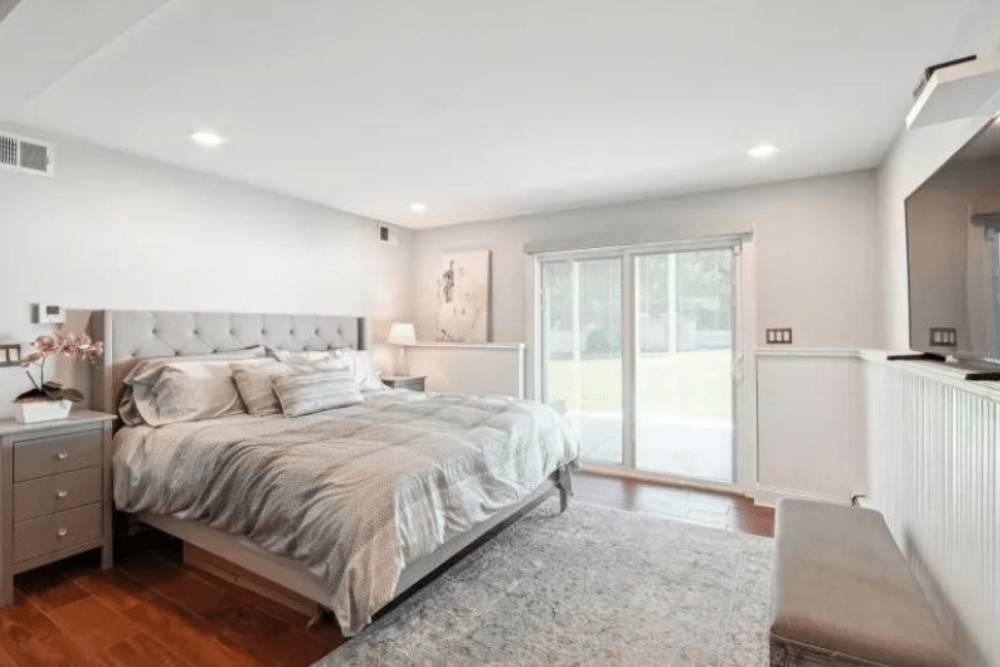 A clean and bright residential bedroom designed for comfort during recovery in a Partial Care Program in New Jersey.