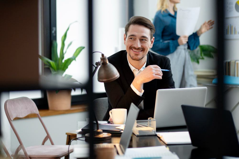 Happy man in office after completing treatment at an Alcohol Rehab in New Jersey