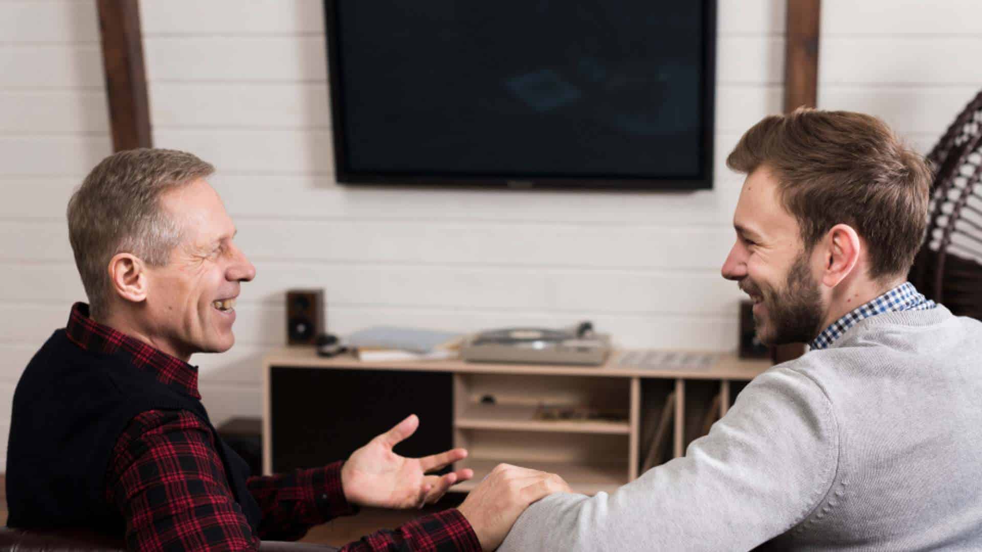 Older man sharing a joyful moment with a friend after recovery at an Alcohol Rehab in New Jersey