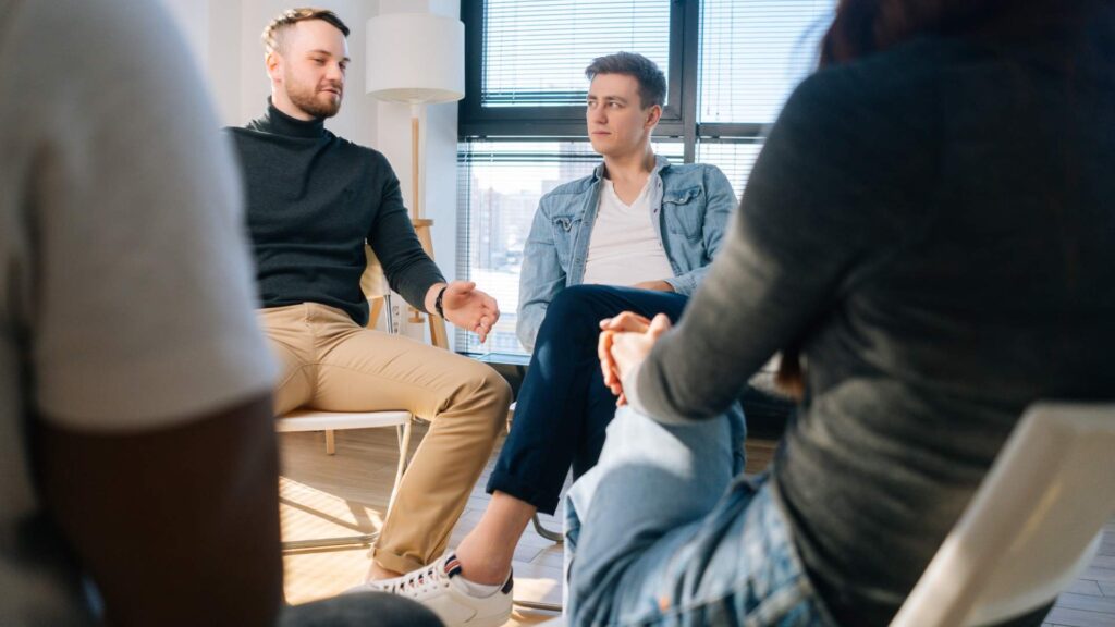 Men participating in a group counseling session as part of Opioid Addiction Treatment in New Jersey