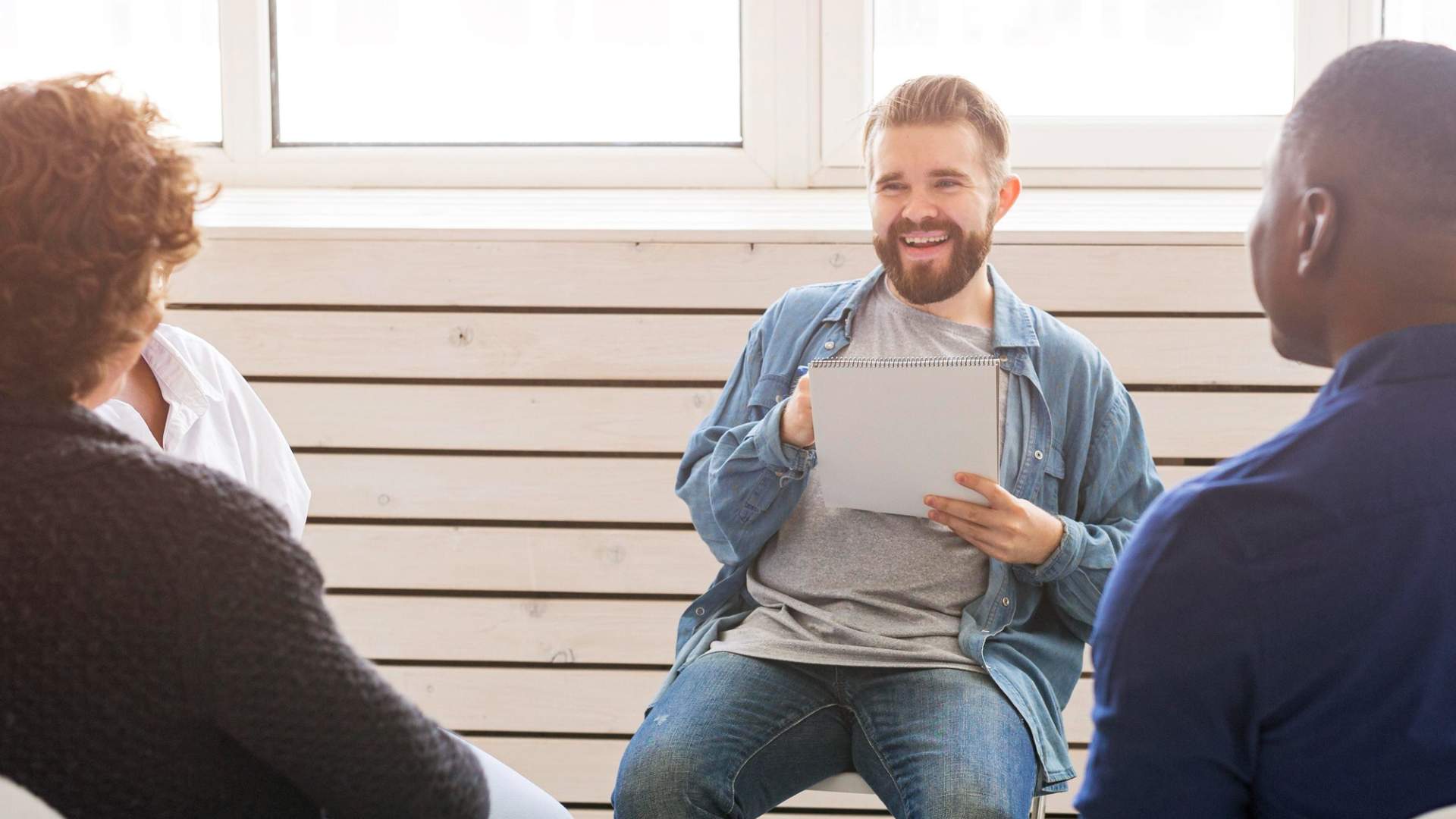 Small group discussion supporting Opioid Addiction Treatment in New Jersey through shared recovery experiences