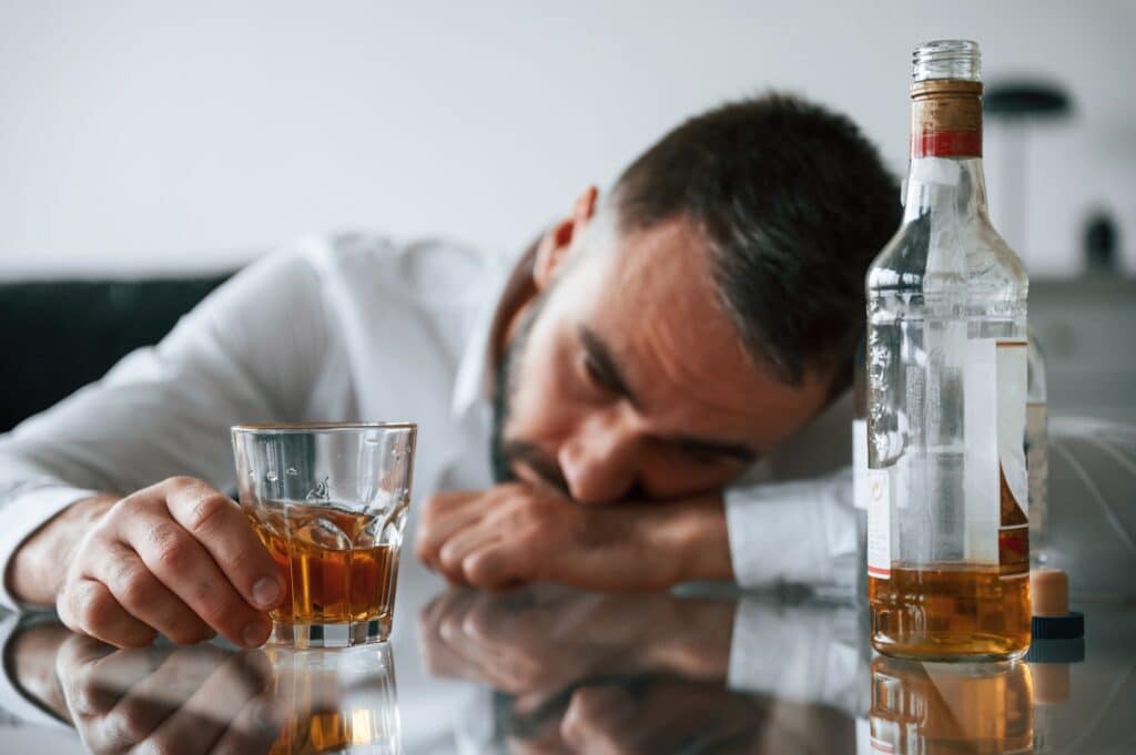Perrson struggling with alcohol addiction before entering our rehab program at NJRS